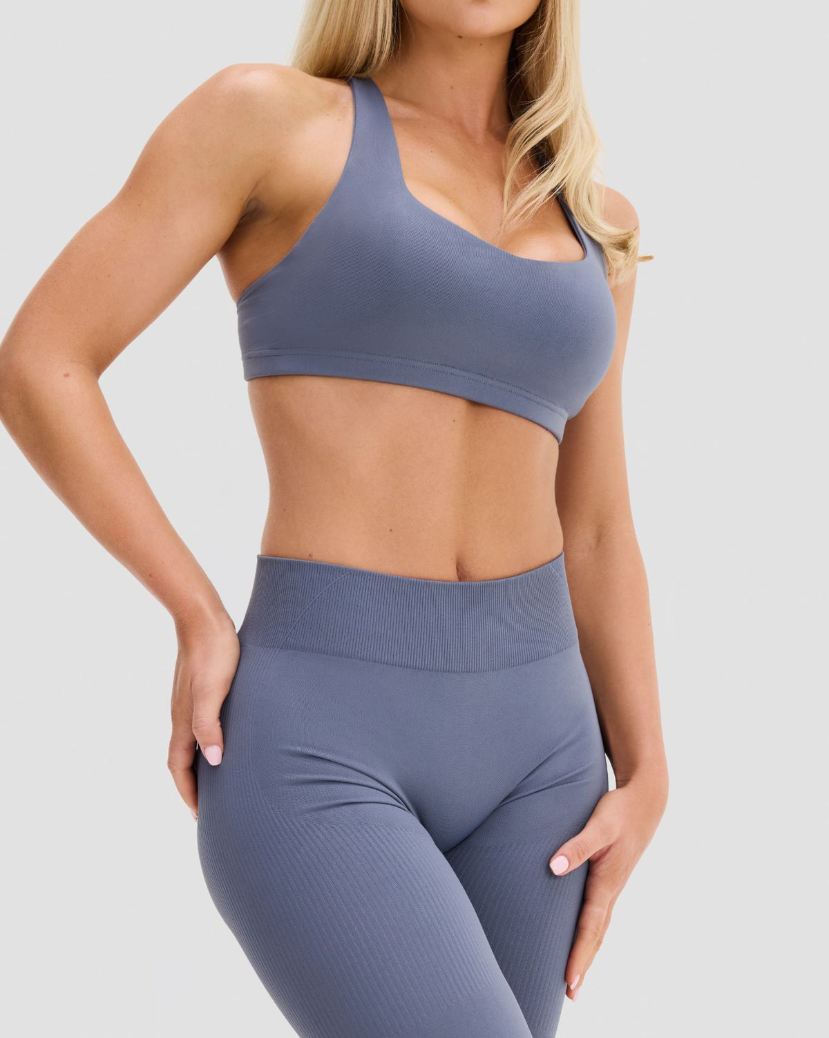 Elevate Sculpting Medium Impact Multiway Bra in Steel Blue, three-quarter front view of wide straps and cropped underband