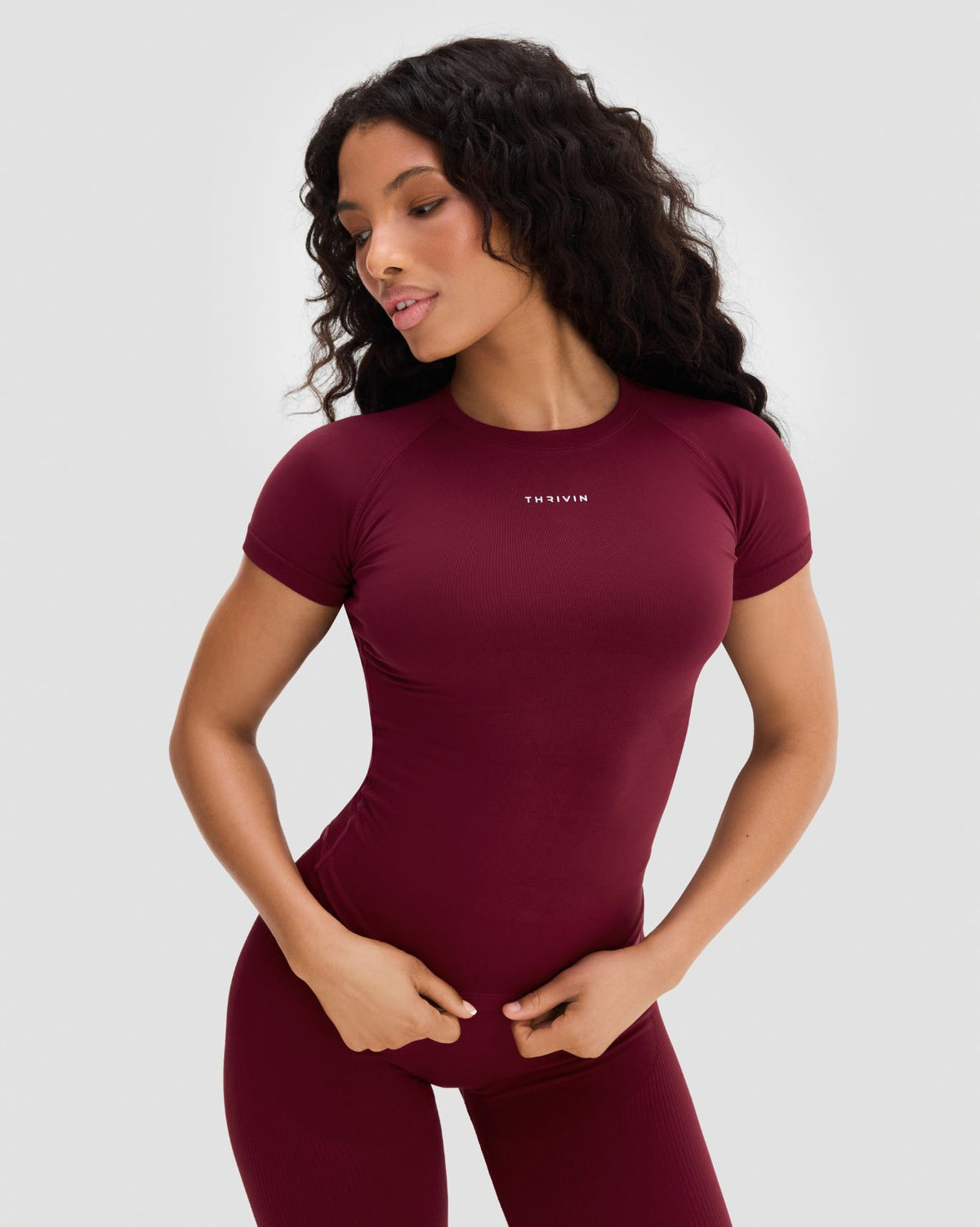 Elevate Compression T-Shirt in Fine Wine Red, front view, hands at waist