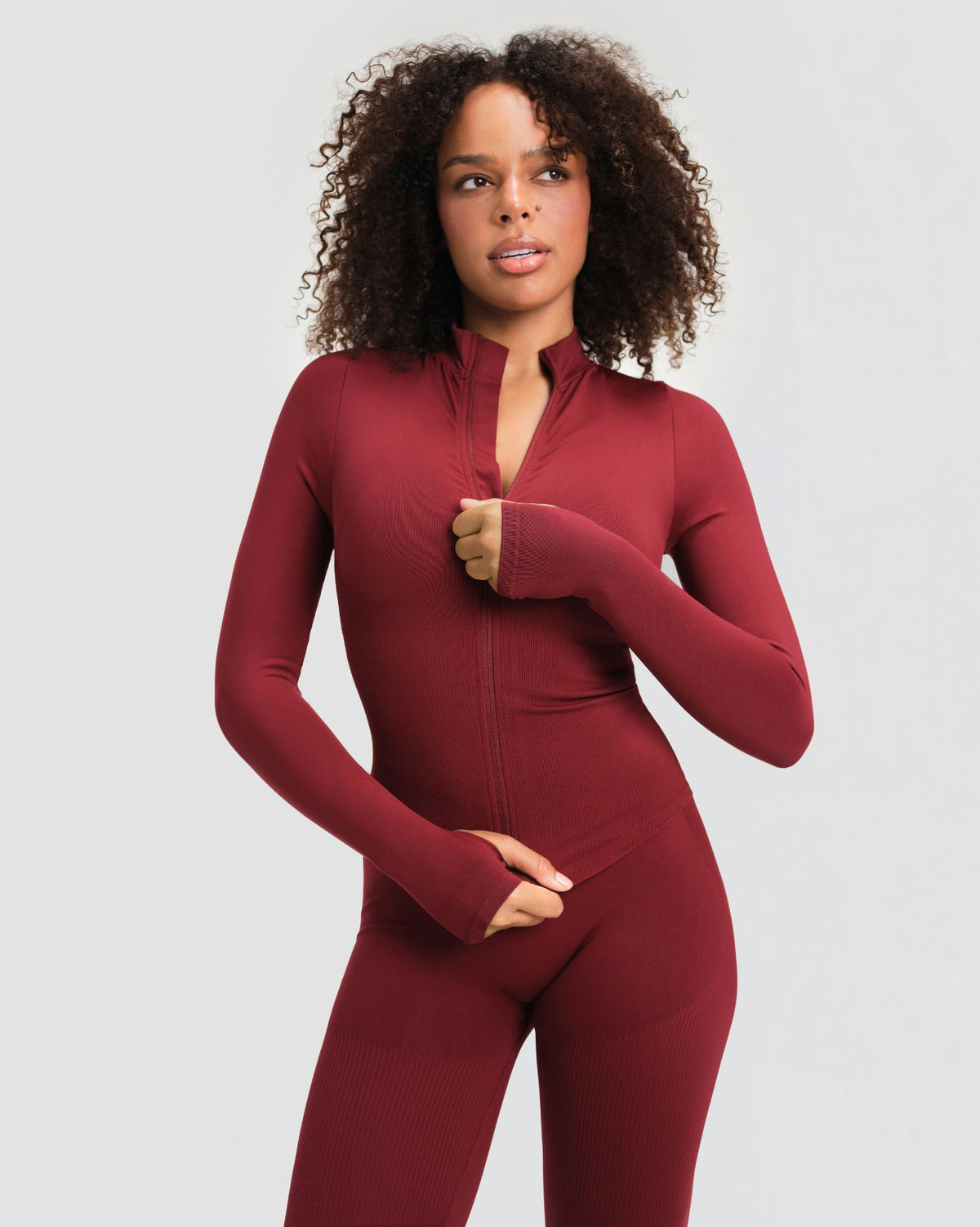 Elevate Compression Long Sleeve Jacket in Fine Wine Red, front view with zip partly undone at the stand collar