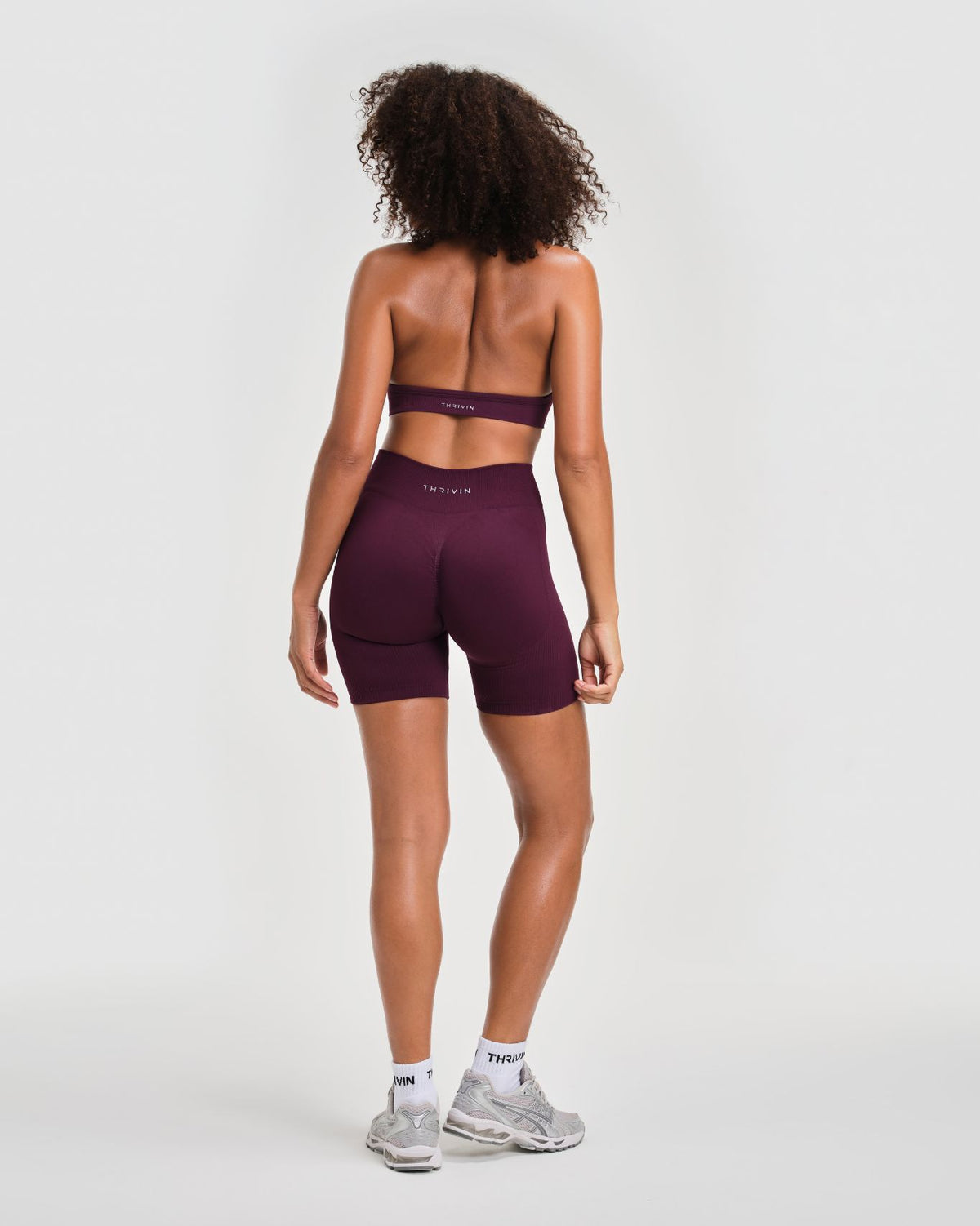 Elevate Sculpting Seamless Adjustable Halter Bra in Winter Plum Red, full-length back view with open back and matching shorts