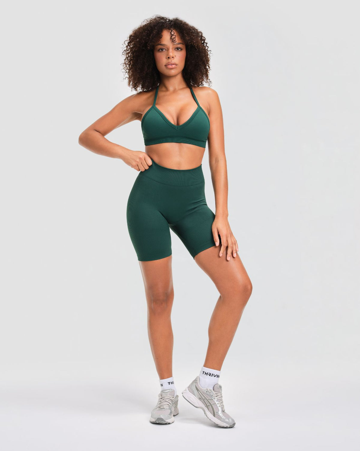 Elevate Sculpting Seamless Adjustable Halter Bra in Pine Green, full-length front view with matching gym shorts