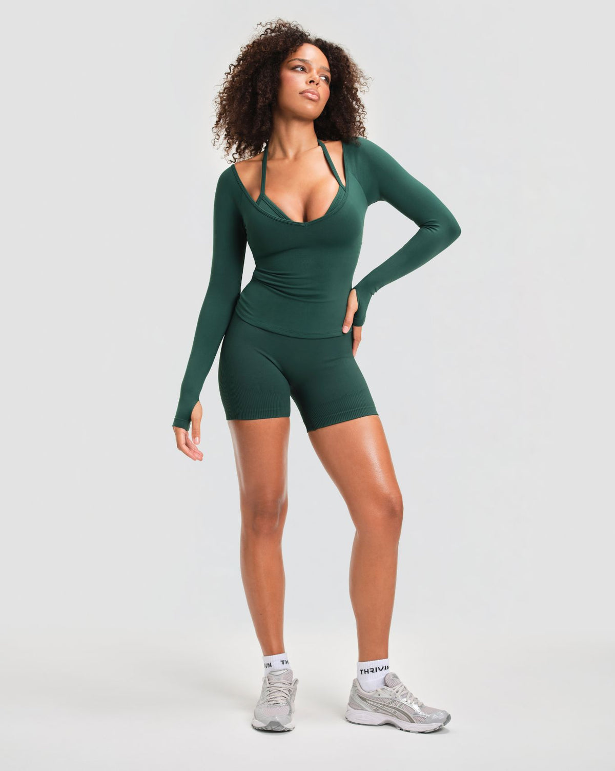 Elevate Sculpting Seamless V-Neck Top in Pine Green, full-length front view of V-neckline and thumbhole sleeves