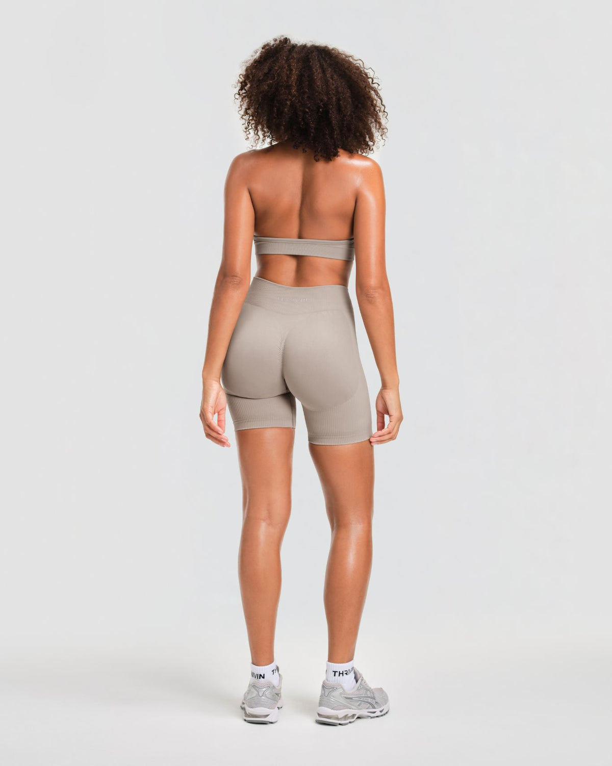 Elevate Sculpting Mid Waist Scrunch Shorts in Latte Grey, full-length back view of contoured seat and mid waist rise