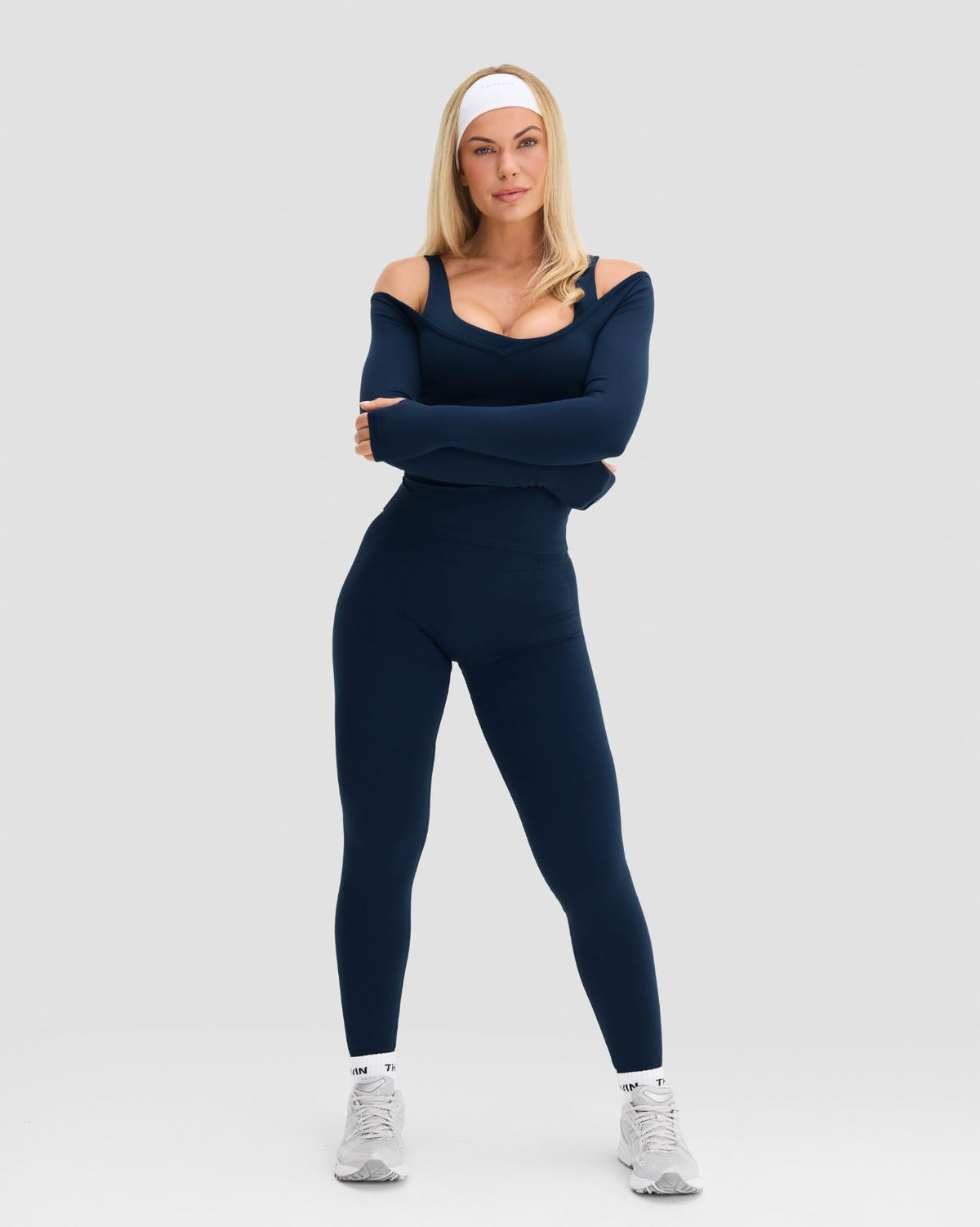 Elevate Sculpting Seamless V-Neck Top in Midnight Navy Blue, full-length front view with arms crossed