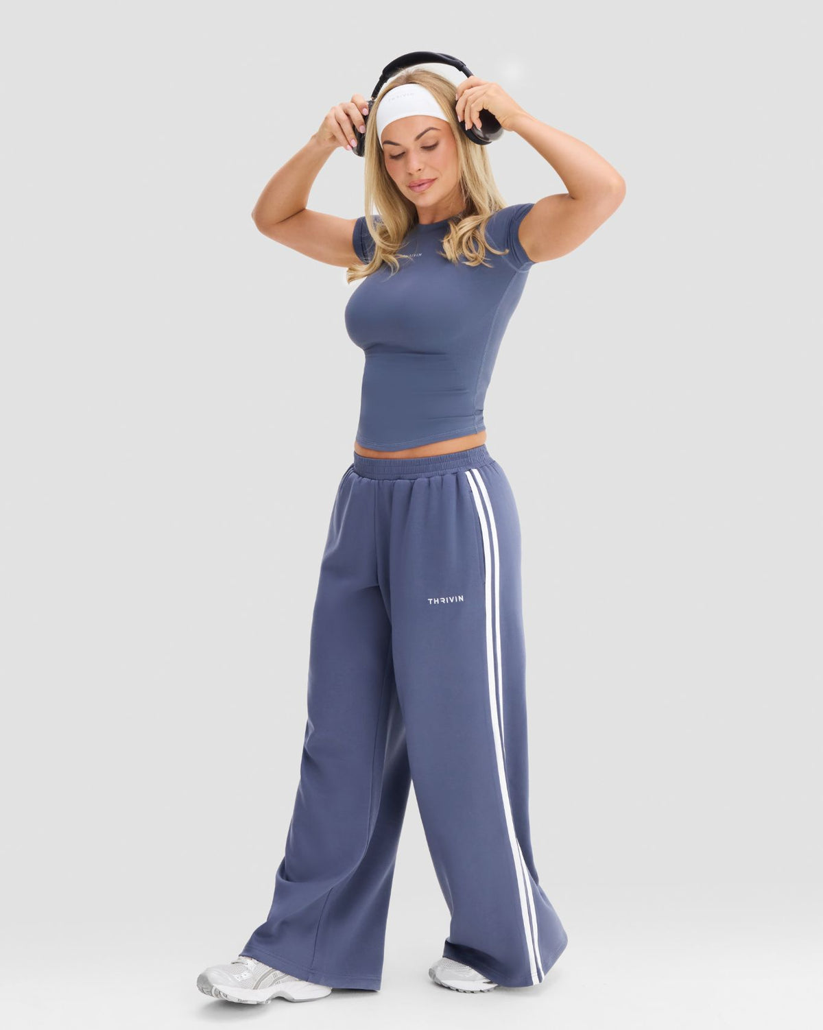 Wide Leg Striped Joggers in Steel Blue, front view of elastic waistband, Thrivin logo and relaxed wide leg