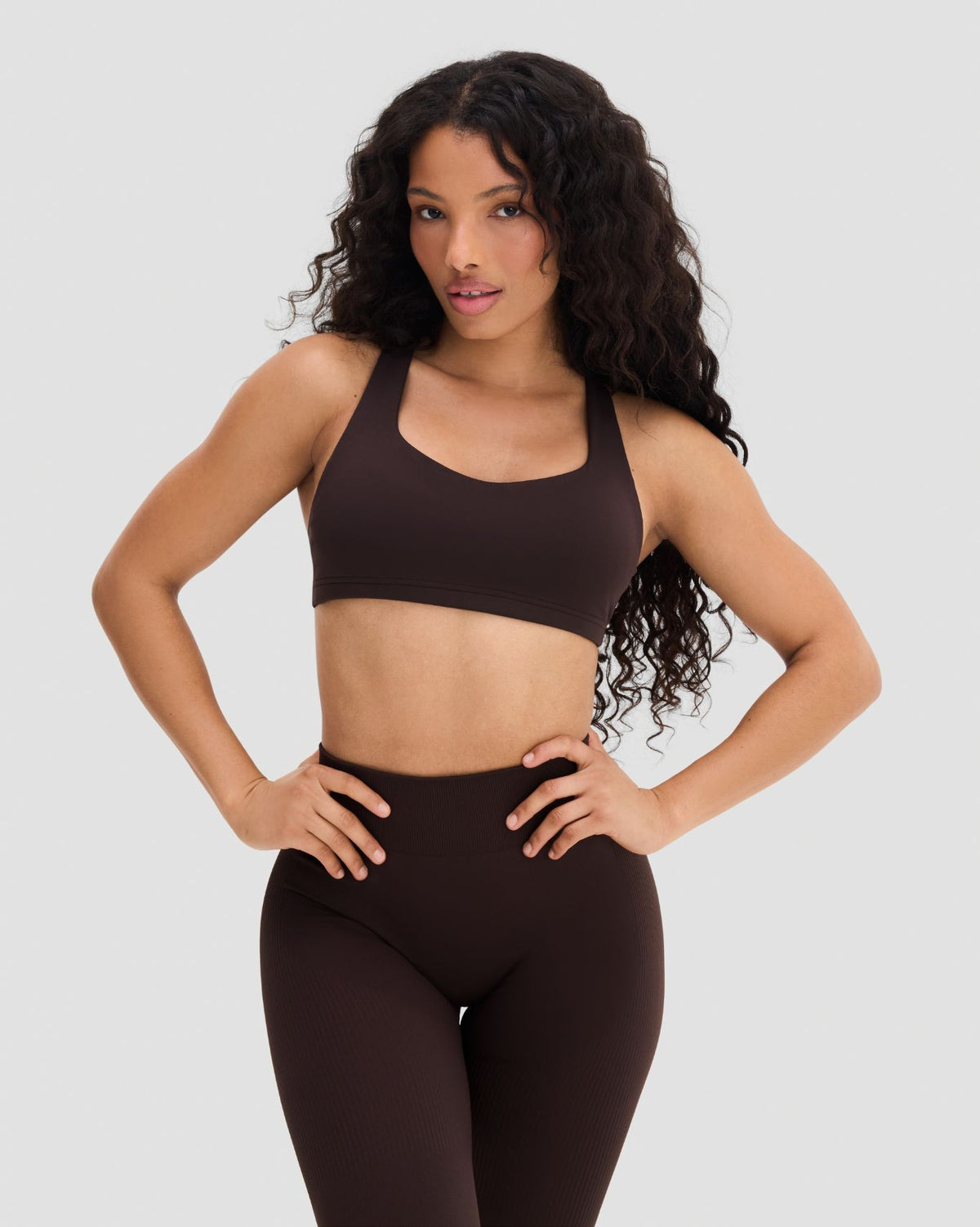 Elevate Sculpting Medium Impact Multiway Bra in Coffee Brown, front view, hands on hips