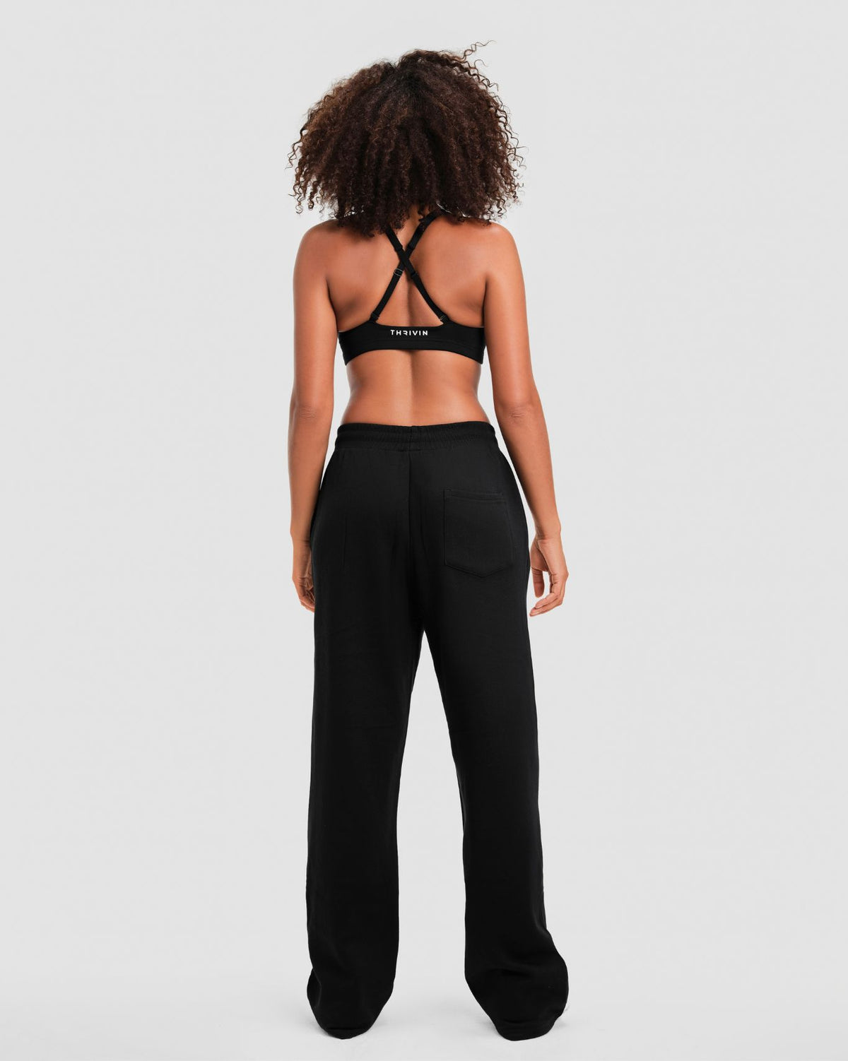 Original Straight Leg Jogger in Night Black, full-length back view with patch back pocket and elasticated waistband