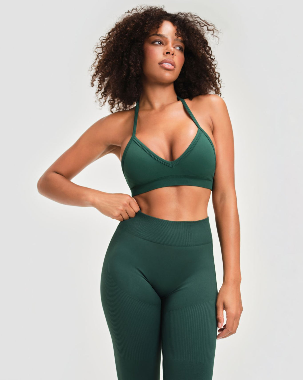 Elevate Sculpting Mid Waist Scrunch Leggings in Pine Green, front close-up of ribbed high waistband with snug sculpting fit