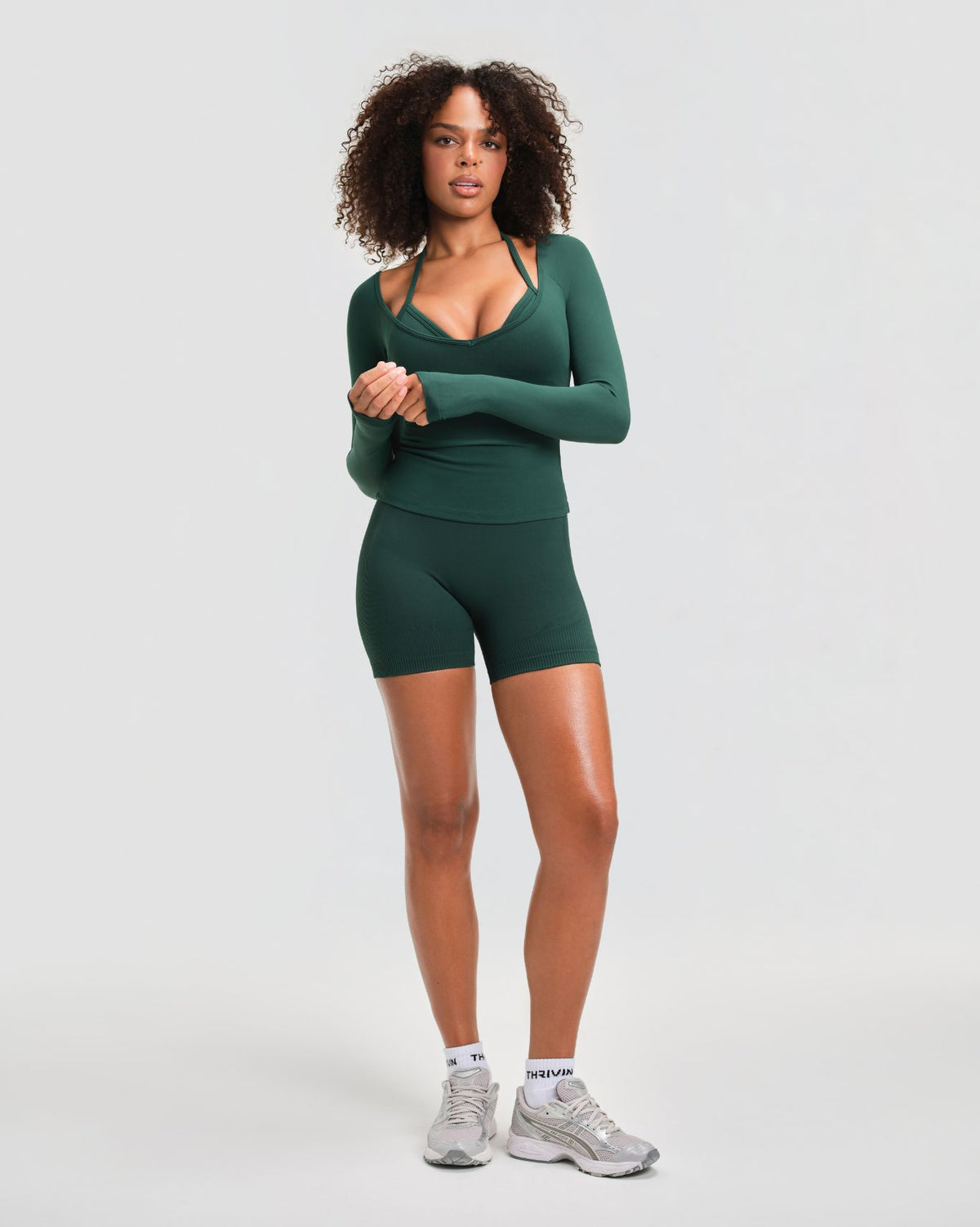 Elevate Sculpting Seamless V-Neck Top in Pine Green, full-length front view styled with matching gym shorts