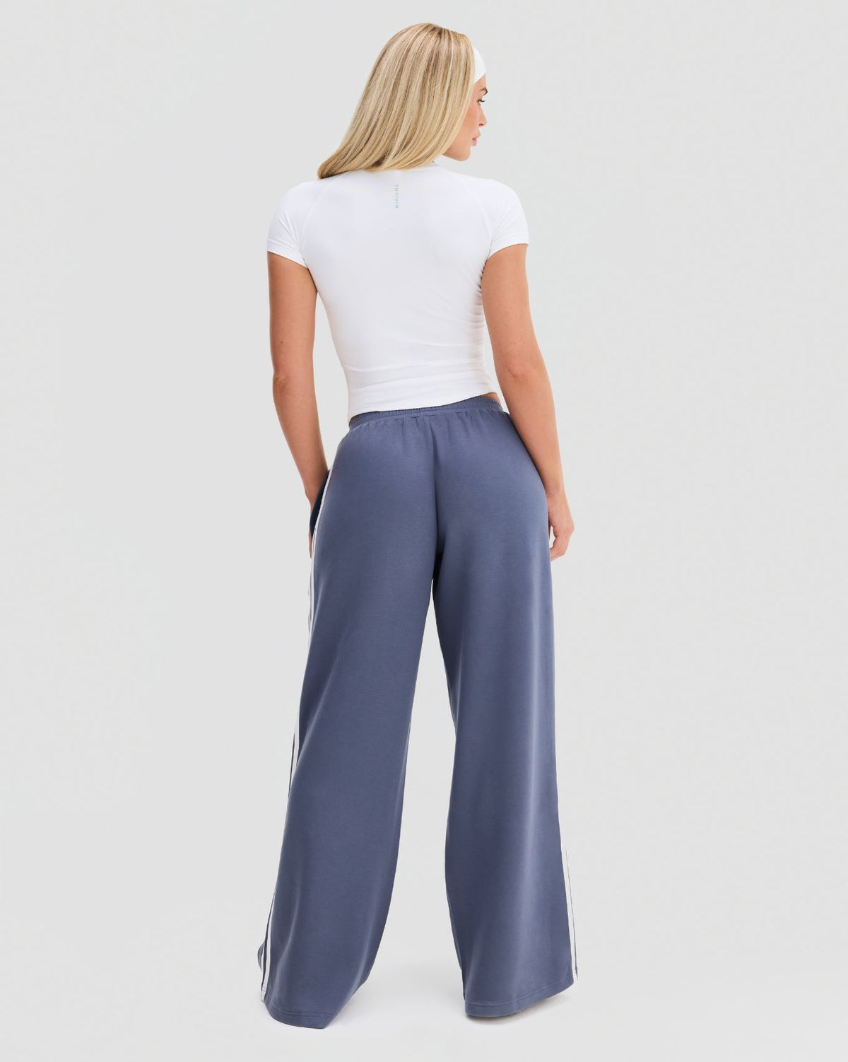 Elevate Compression T-Shirt in White, full-length back view with raglan sleeves and fitted waist-length hem