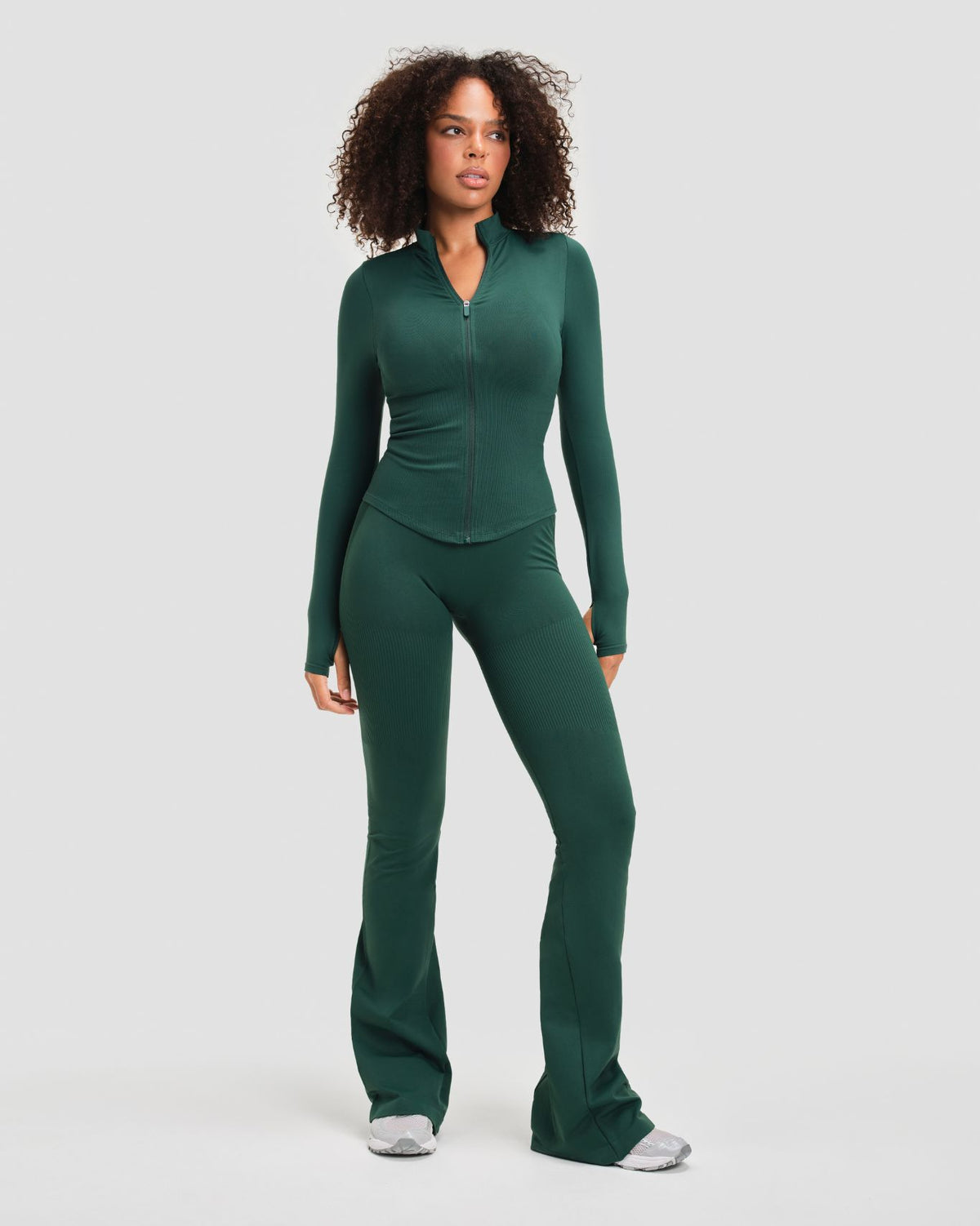 Elevate Compression Long Sleeve Jacket in Pine Green, full-length front view with fitted waist, thumbholes and flare leggings