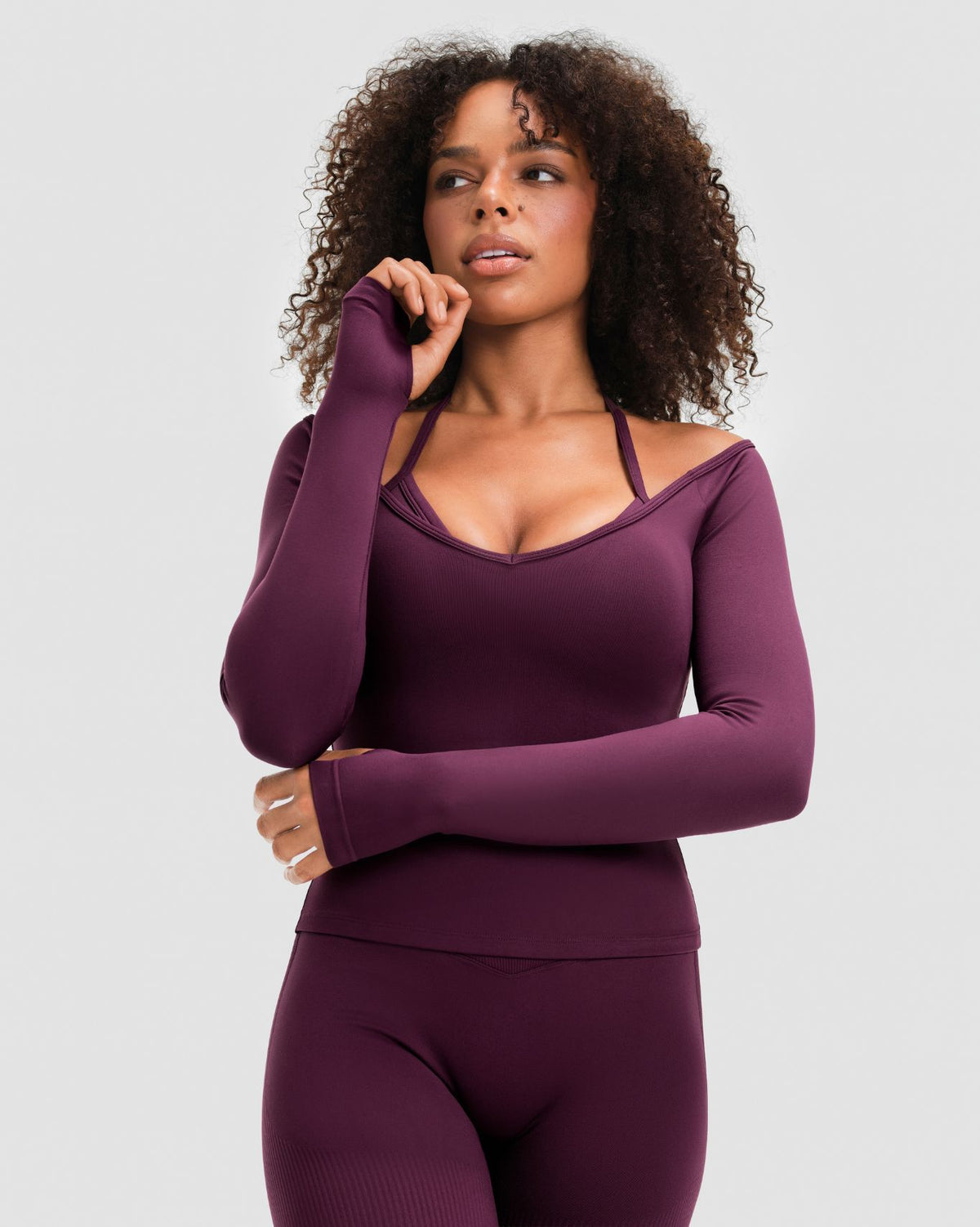 Elevate Sculpting Seamless V-Neck Top in Winter Plum Red, front view with V-neckline, thumbholes and matching leggings