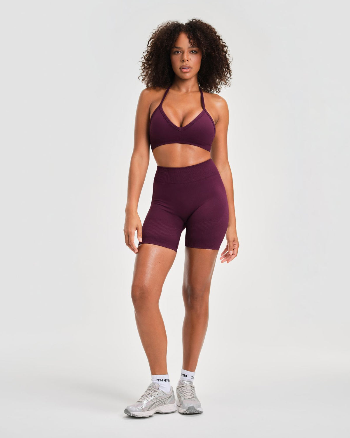 Elevate Sculpting Seamless Adjustable Halter Bra in Winter Plum Red, full-length front view with V-neckline and halter straps