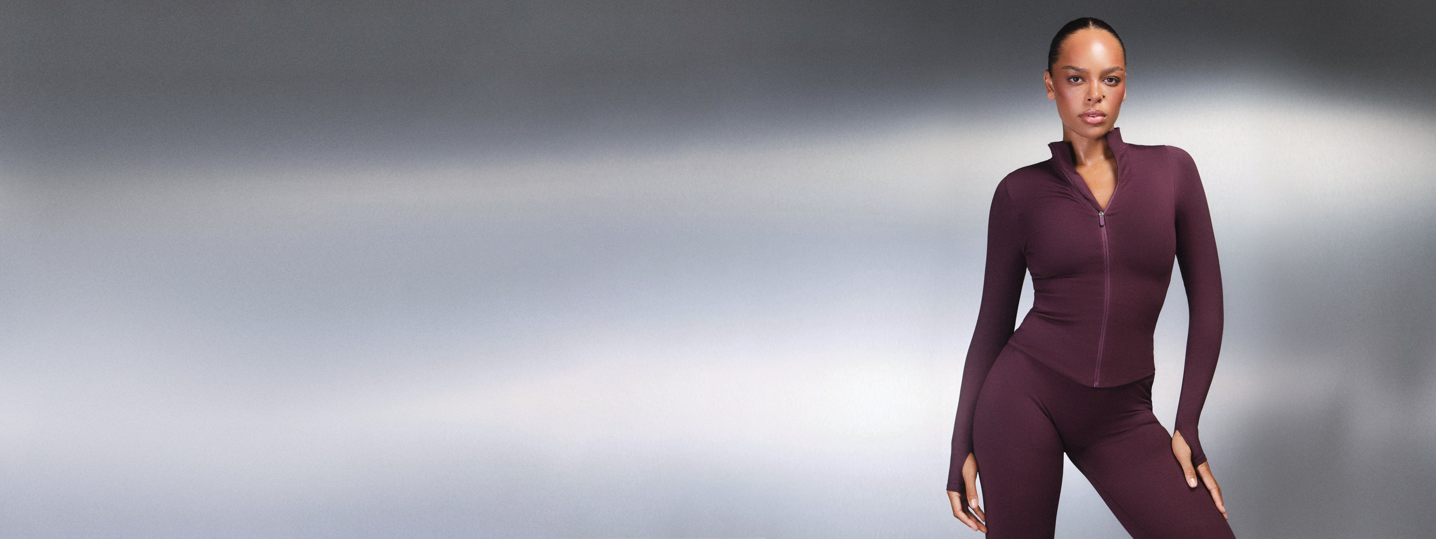 Banner of plum full-zip jacket with thumbholes and matching leggings