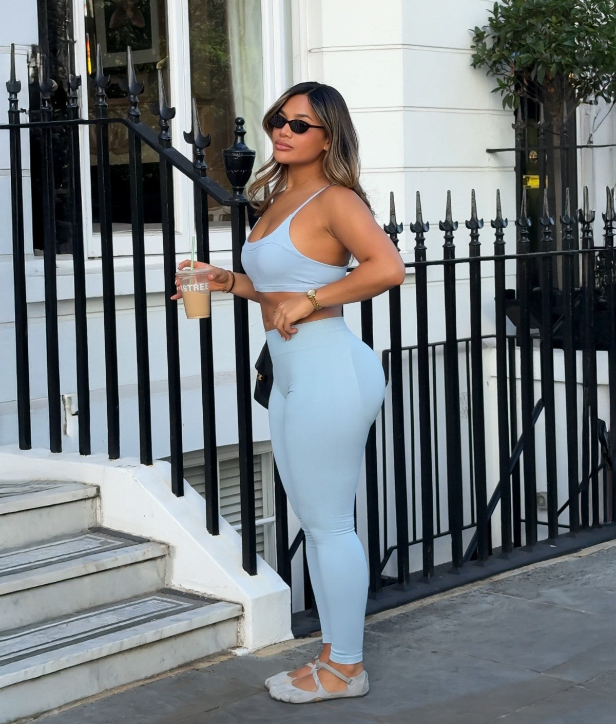 Light blue scoop neck sports bra with thin straps and matching leggings