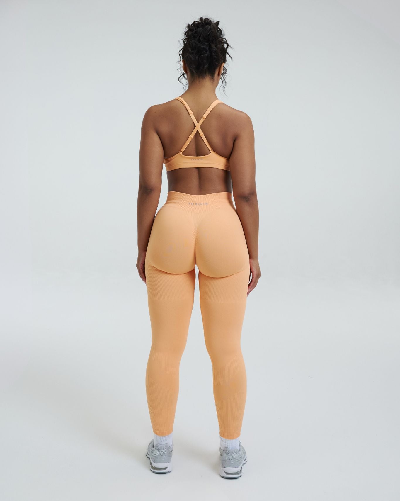 Elevate™ Leggings de modelado de cintura media con fruncido | Melón