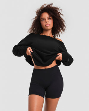 The Essential Collection Off The Shoulder Wool Blend Sweater in Night Black, front view off one shoulder, ribbed cuffs