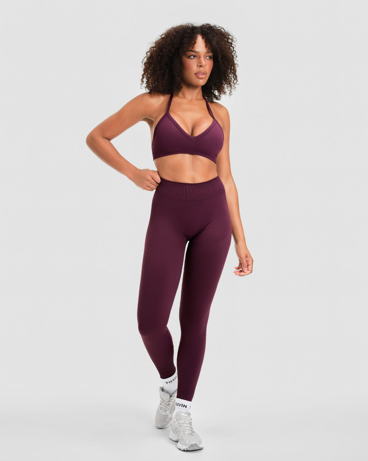 Elevate Sculpting Mid Waist Scrunch Leggings in Winter Plum Red, front view, styled with halter sports bra
