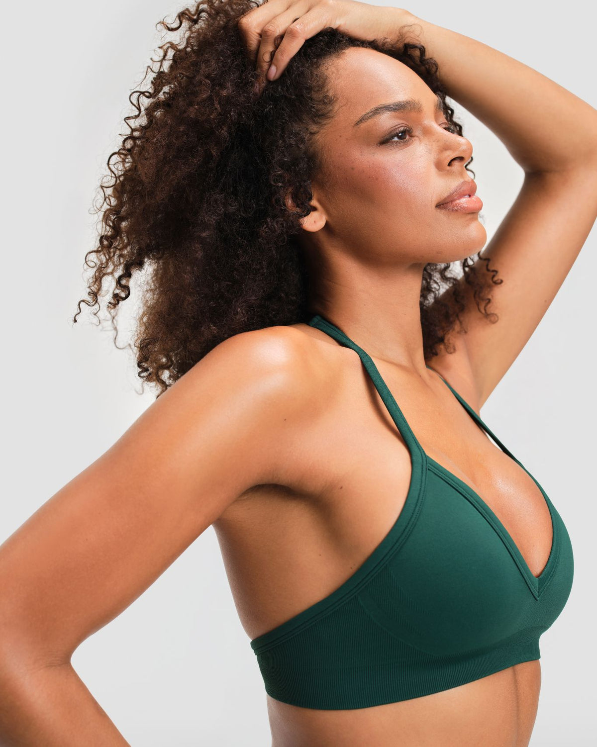 Elevate Sculpting Seamless Adjustable Halter Bra in Pine Green, side close-up of halter strap and V-neckline