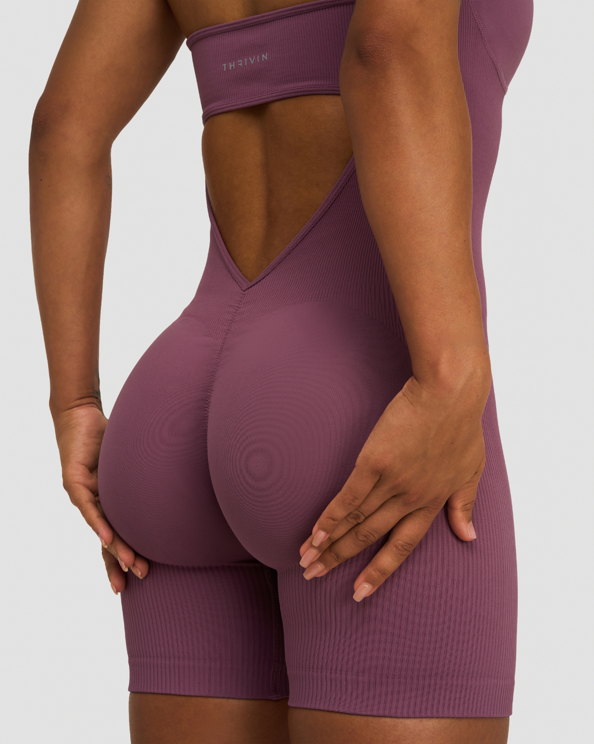 Elevate Sculpting Halterneck All In One in Orchid Mauve, back close-up of scrunch seam, V-shaped open back and snug fit