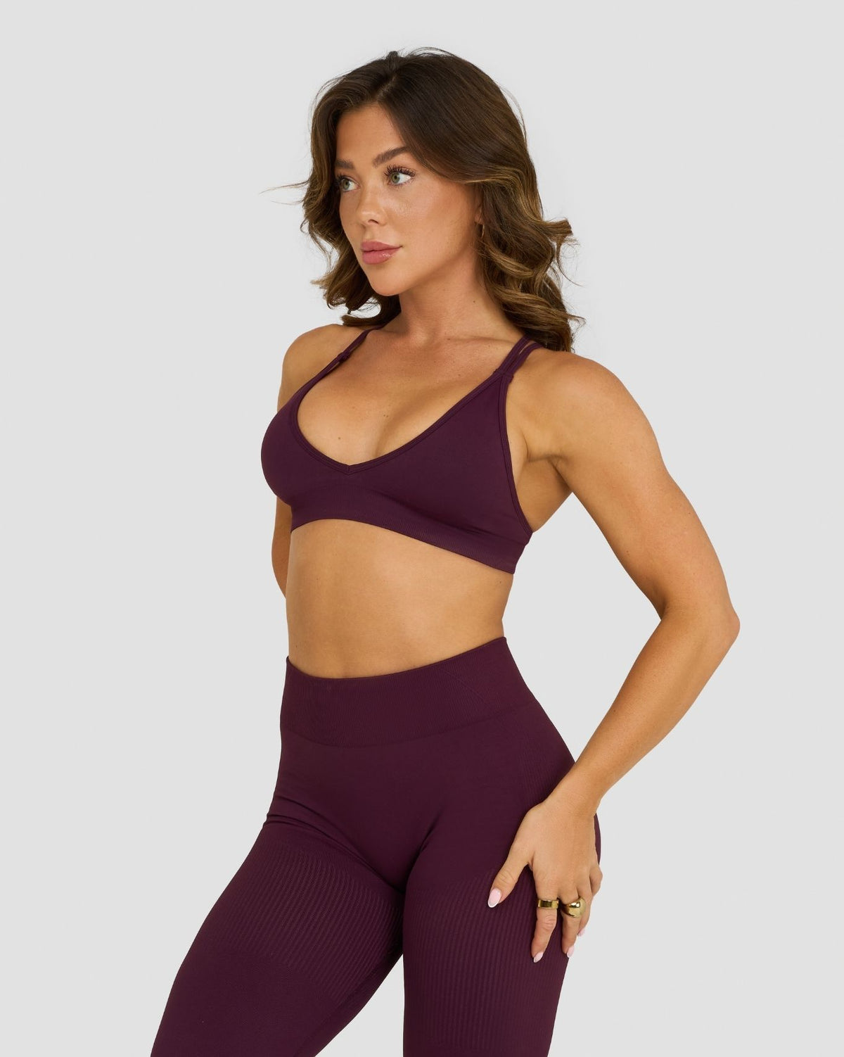 Elevate Sculpting Seamless High Apex Bra in Winter Plum Red, three-quarter front view of V-neckline and smooth sculpting knit