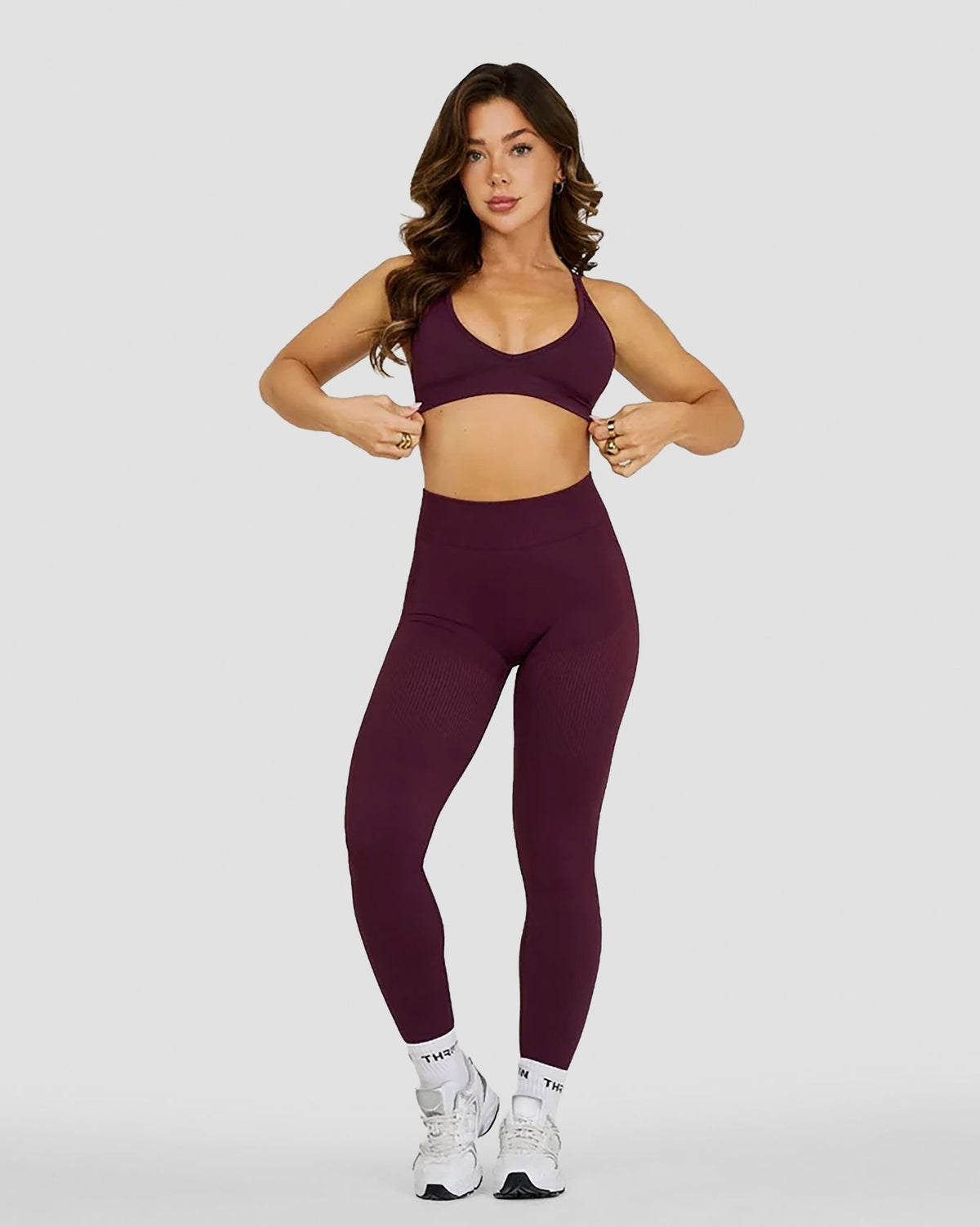 Elevate Sculpting Seamless High Apex Bra in Winter Plum Red, full-length front view of V-neckline with matching leggings
