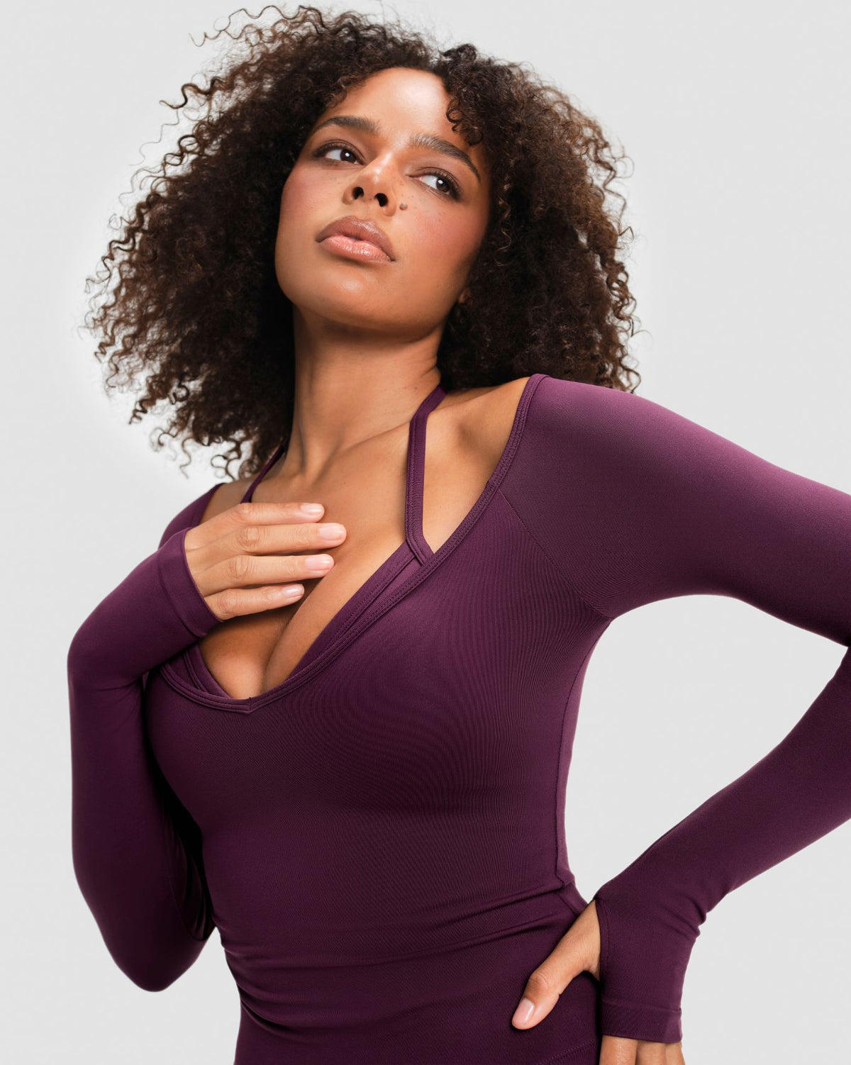 Elevate Sculpting Seamless V-Neck Top in Winter Plum Red, close-up of V-neckline with snug sculpting fit through the waist