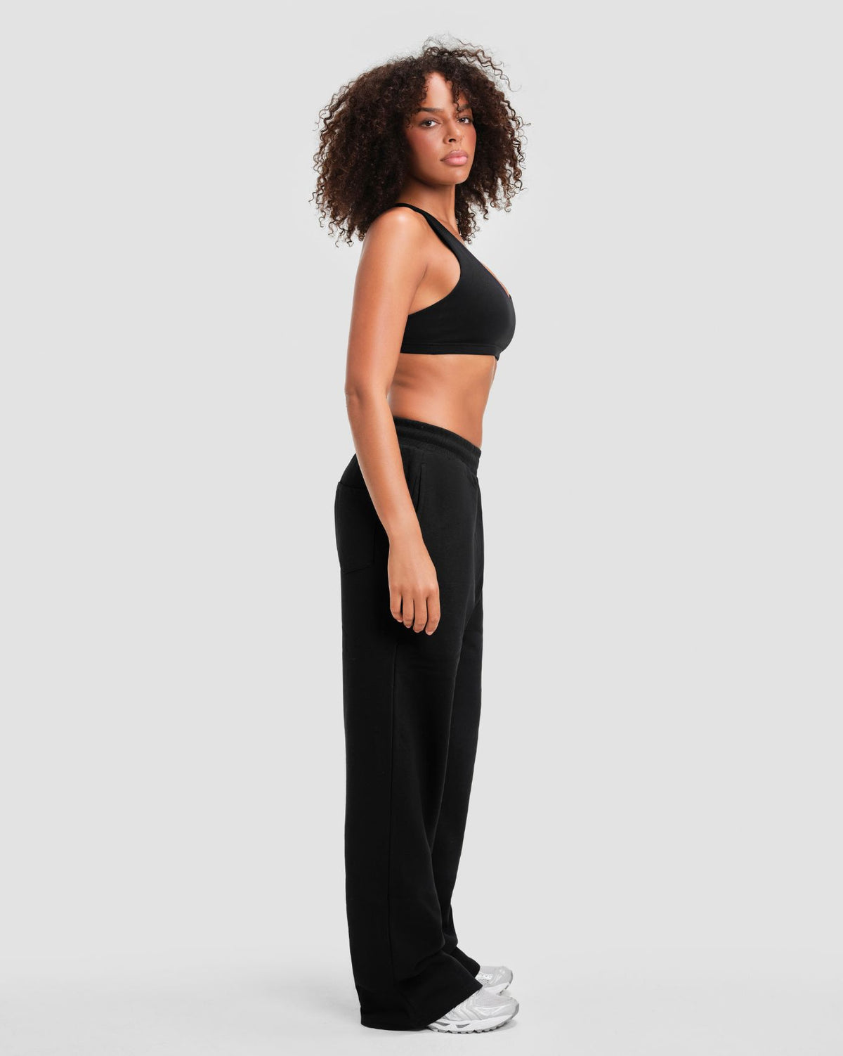 Original Straight Leg Jogger in Night Black, side view of the relaxed straight leg falling to the ankle