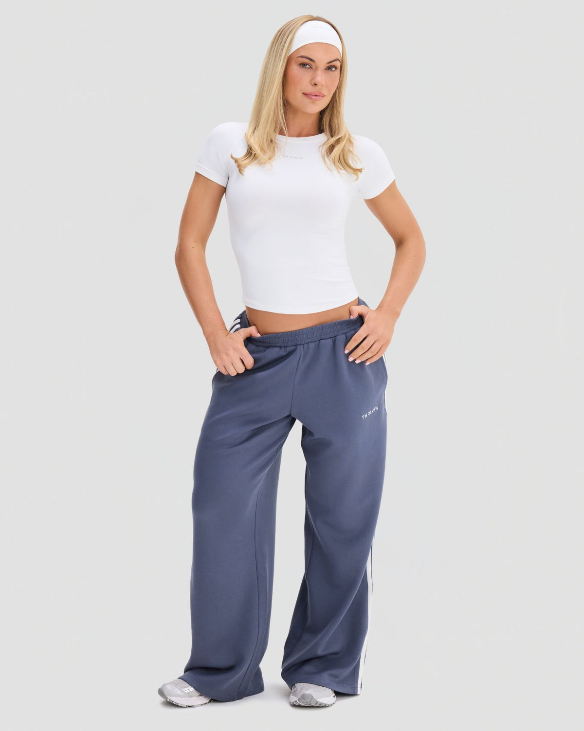 Elevate Compression T-Shirt in White, full-length front view showing the fitted body, crew neck and waist-length hem