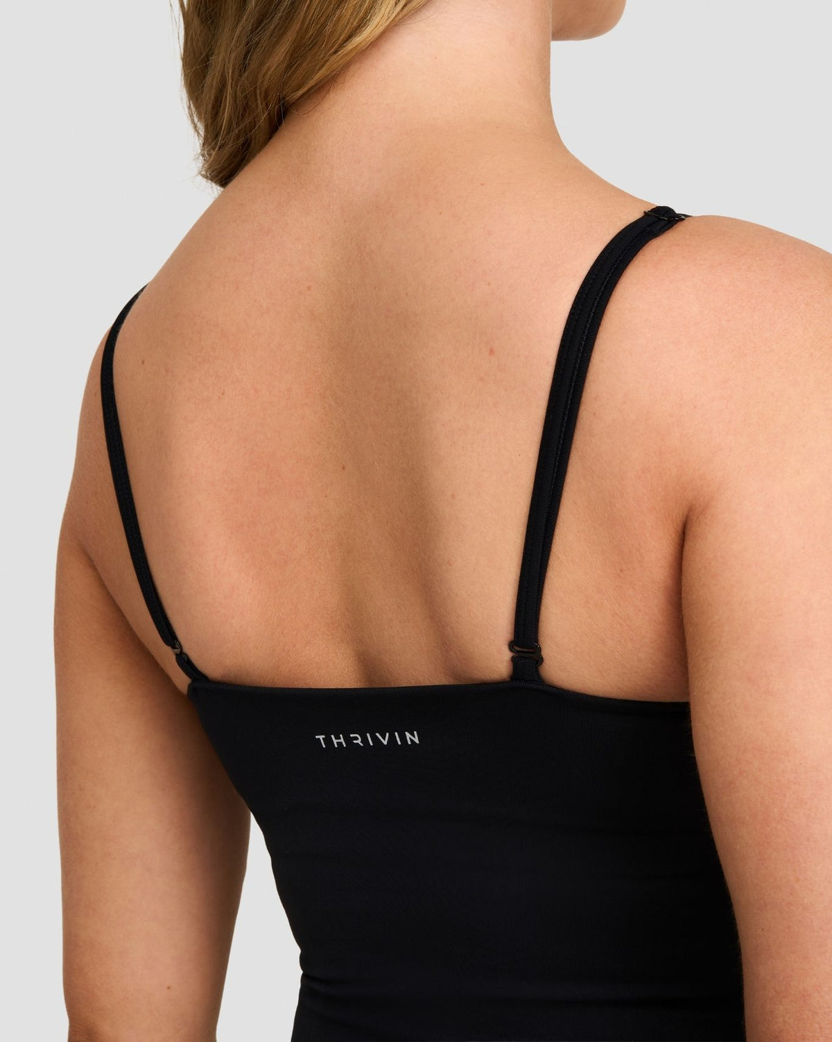 Elevate Sculpting Seamless Scoop Neck Cami in Night Black, back close-up of thin straps and THRIVIN logo