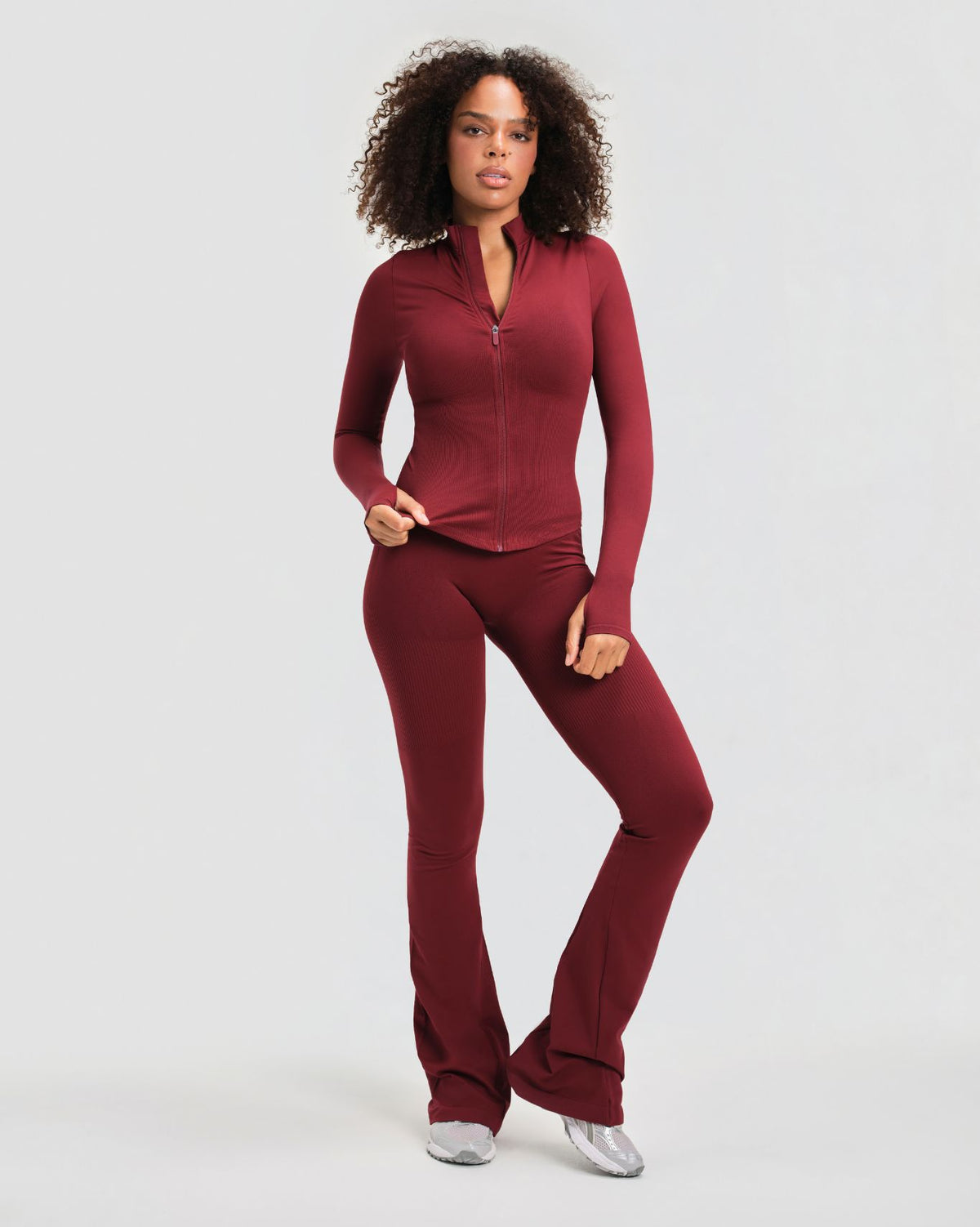 Elevate Compression Long Sleeve Jacket in Fine Wine Red, full-length front view with matching flare leggings