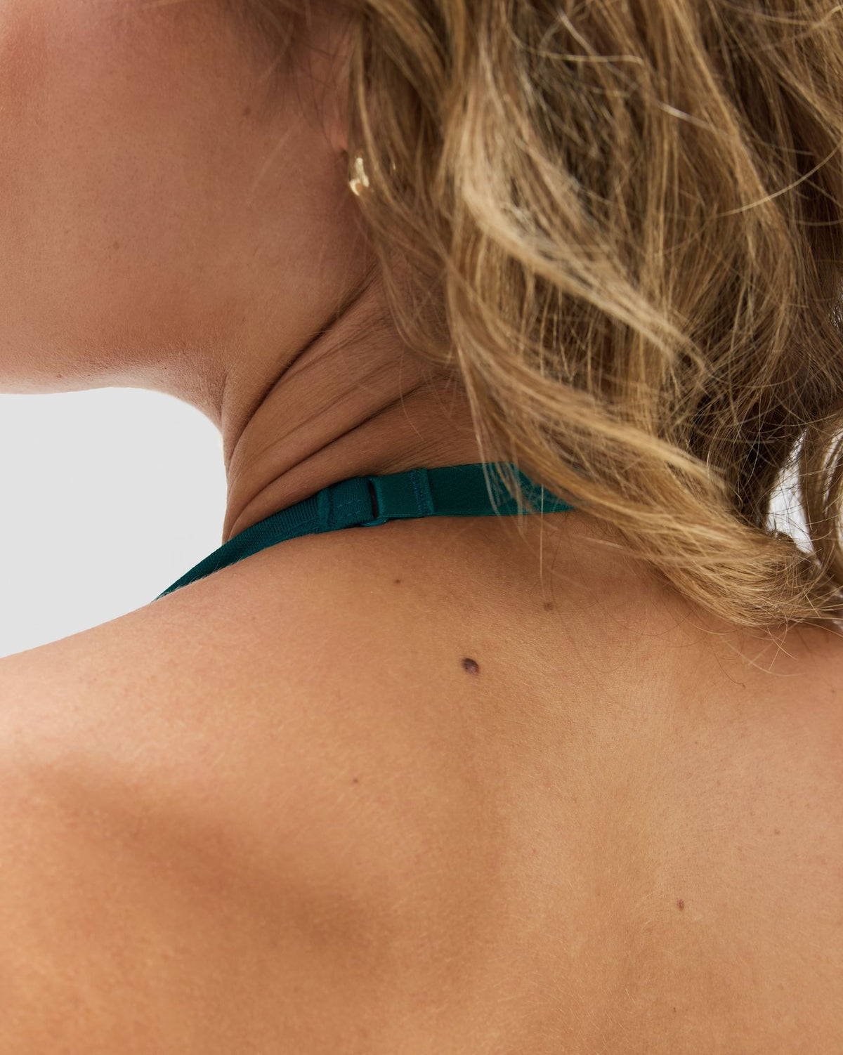 Elevate Sculpting Seamless Adjustable Halter Bra in Harbor Blue, back close-up of adjustable halter strap slider