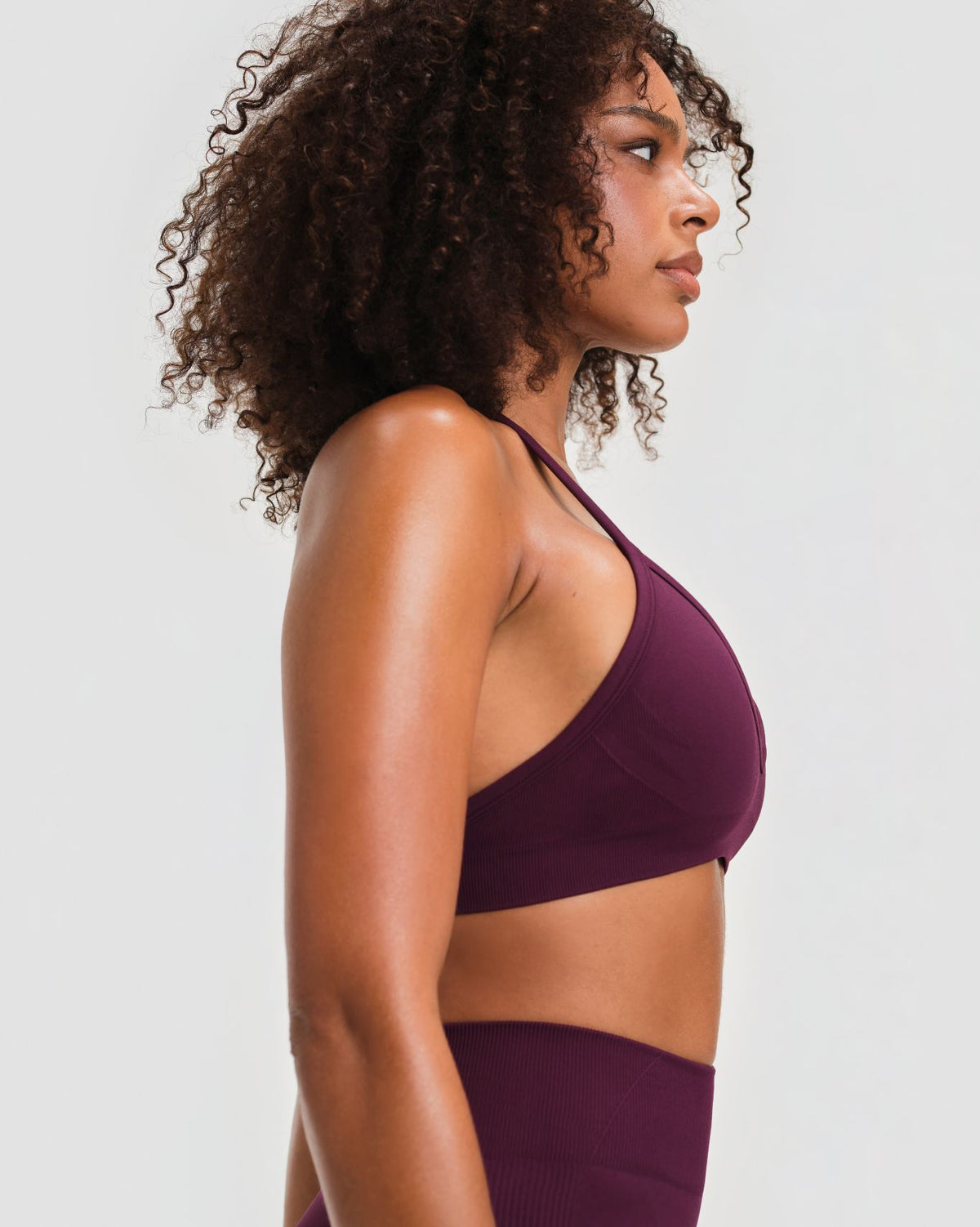 Elevate Sculpting Seamless Adjustable Halter Bra in Winter Plum Red, side close-up of halter strap and ribbed fabric