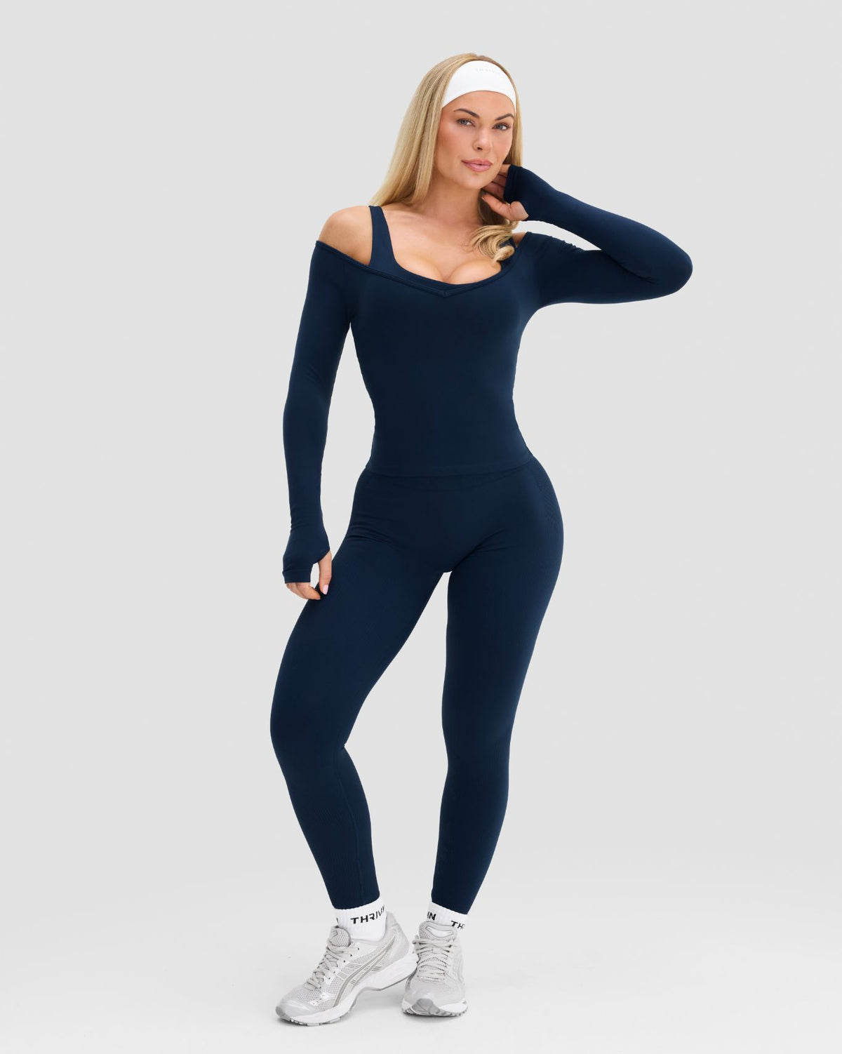 Elevate Sculpting Seamless V-Neck Top in Midnight Navy Blue, full-length front view with hand raised, styled with leggings