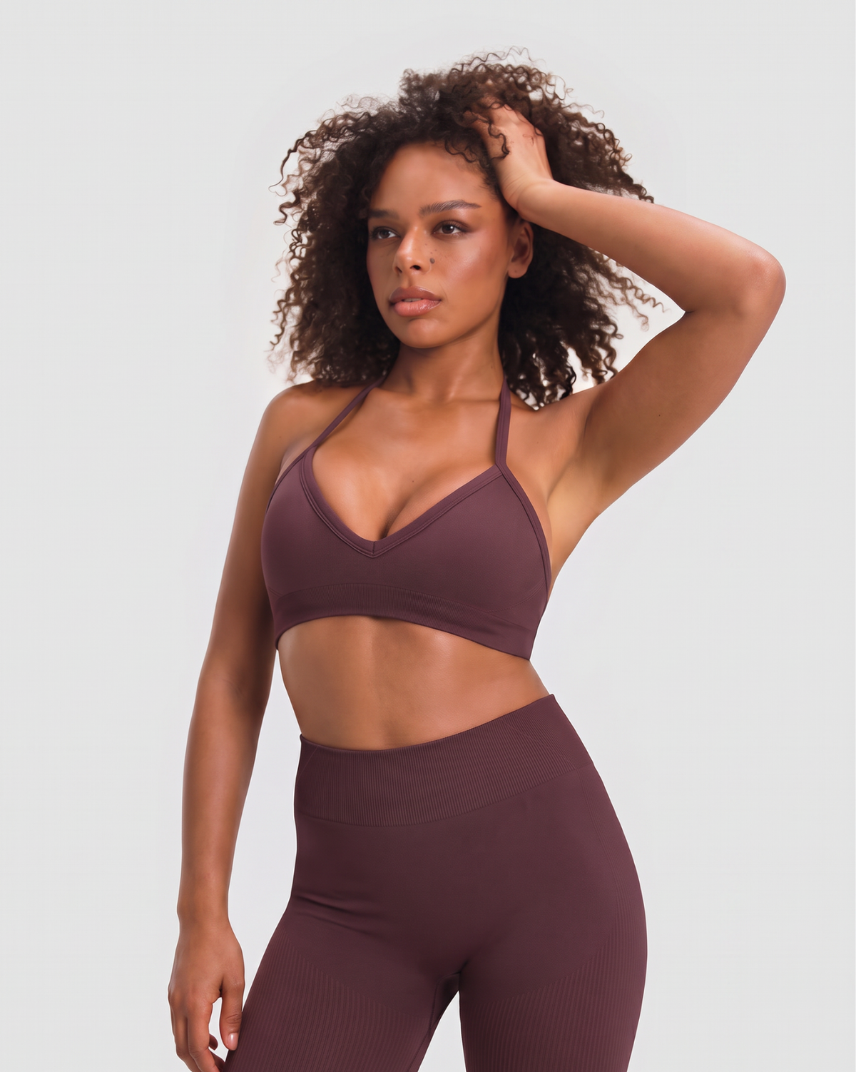 The Wrapped Up 3-Piece Bundle, front view of Dark Mauve halter bra with V-neckline and ribbed mid waist scrunch leggings